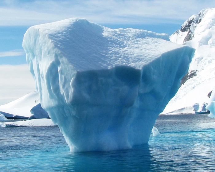 An iceberg floating in sea water
