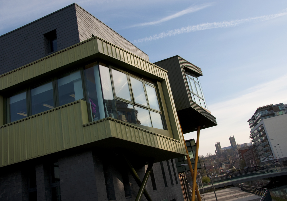 Exterior shot of Sparkhouse with clear blue sky above and Lincoln Cathedral visible in the distance