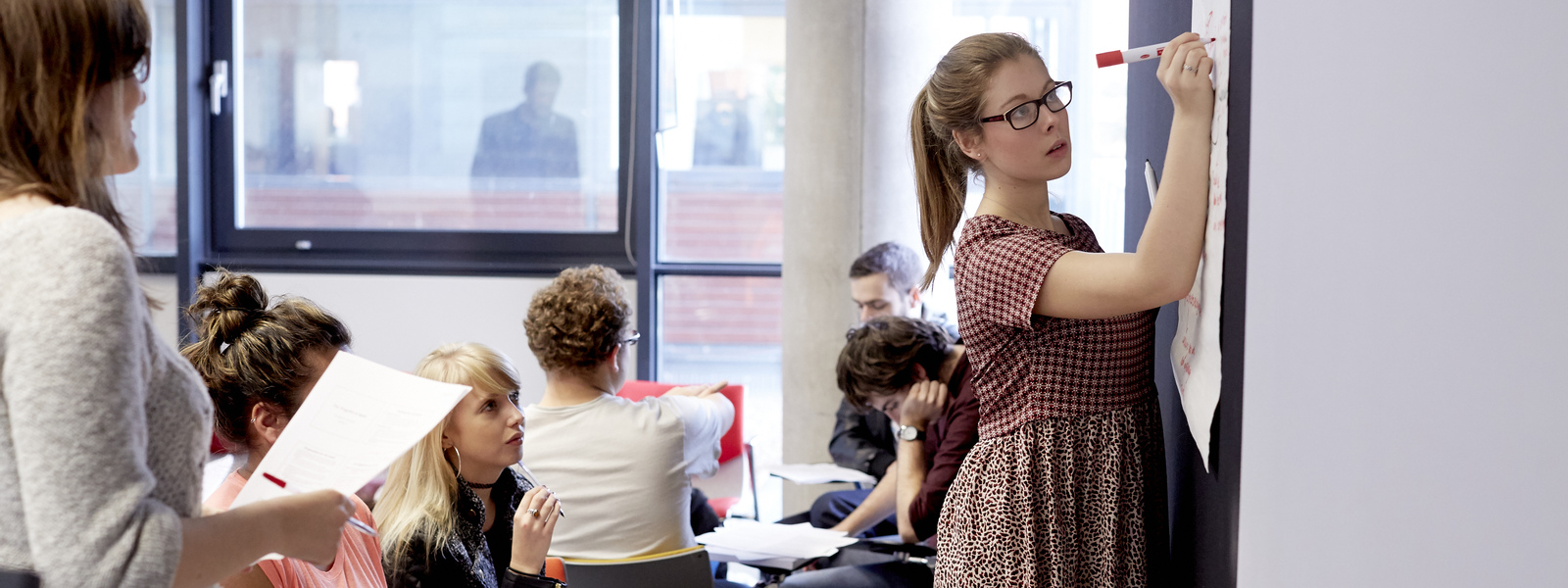 Group of students in a classroom setting.