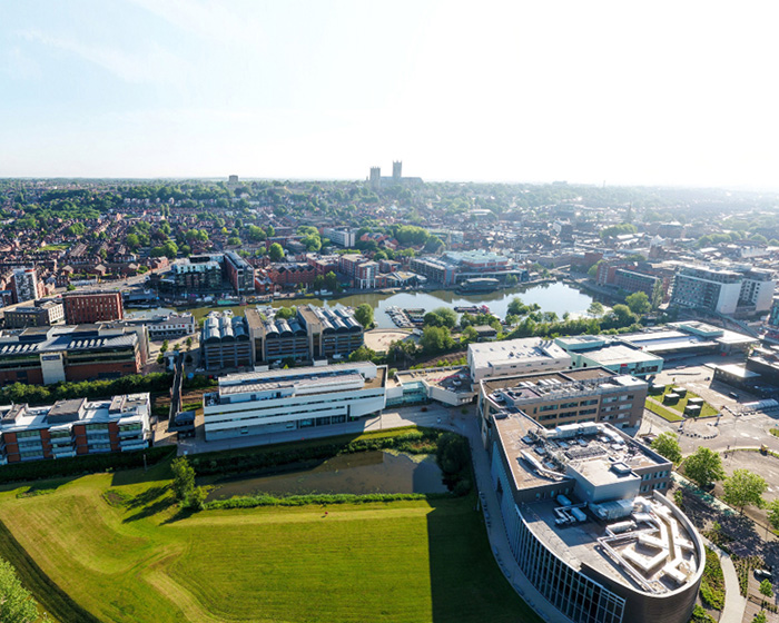 Aerial view of the University campus, with the Cathedral visible in the distance