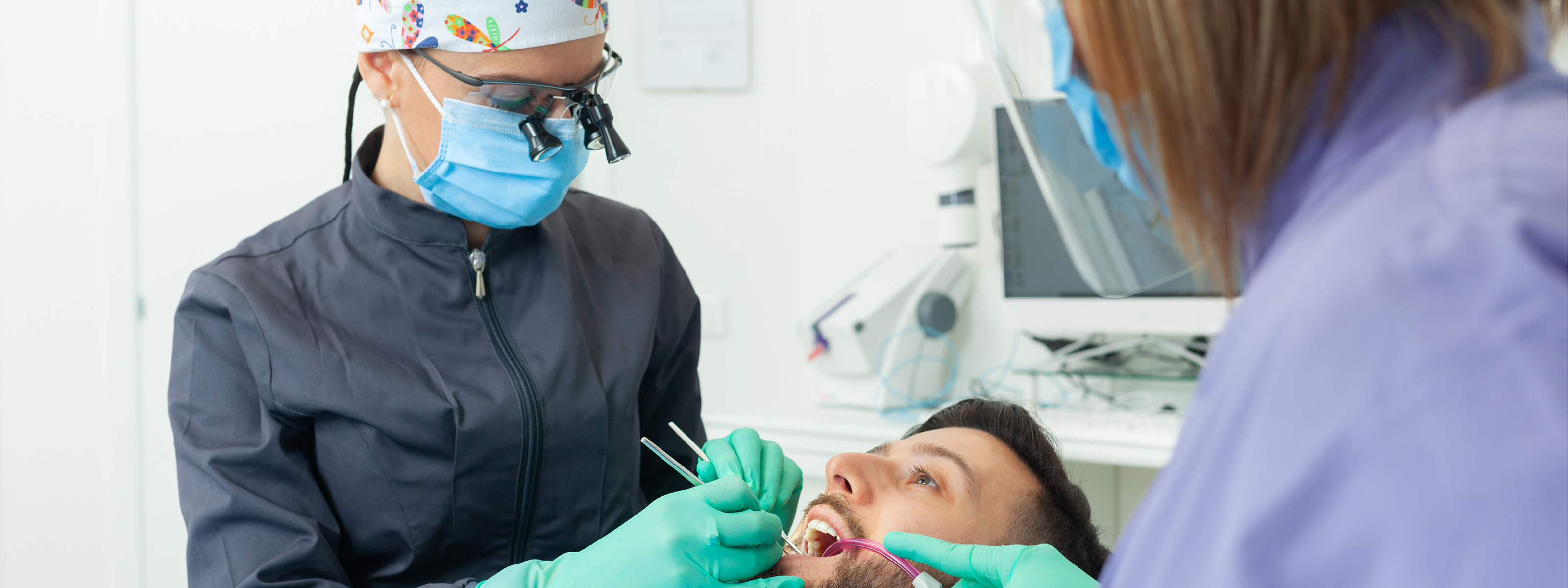 A dentist carrying out a dental examination on a patient