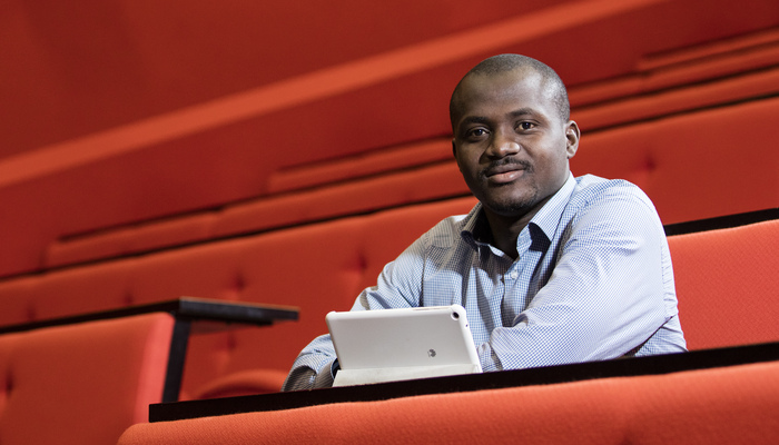 A male student taking part in a lecture