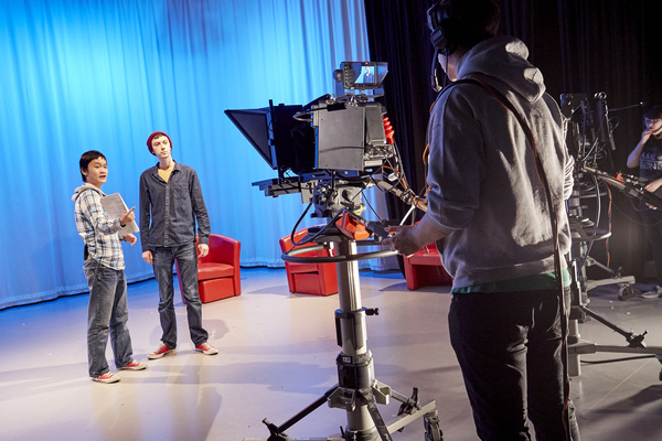 Students working filming in a studio