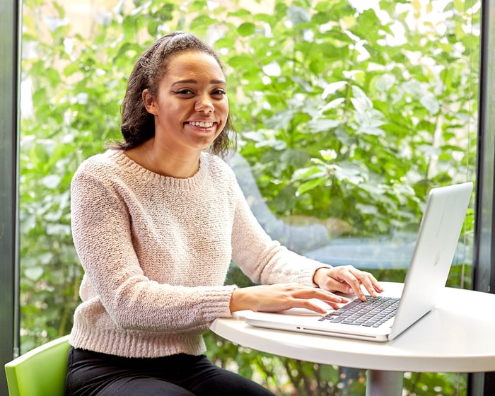 Student sitting at a desk with laptop