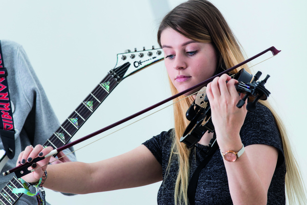 A music student playing a violin