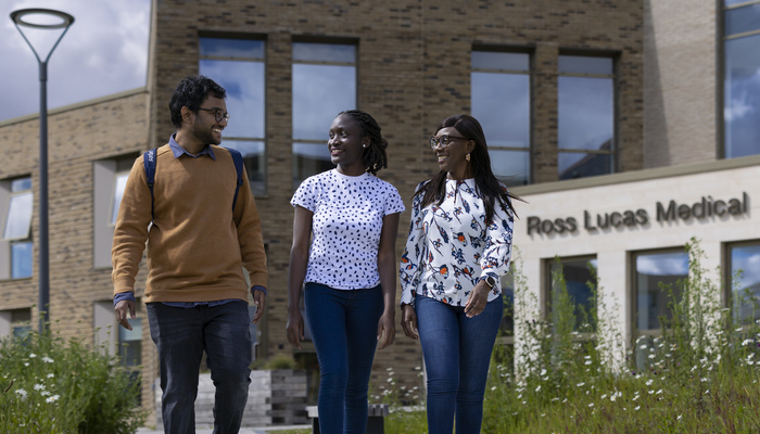 Students walking on campus outside the Medical School