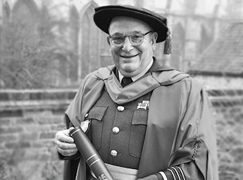 Sir Stuart Peach is pictured with his Honorary Doctorate from the University of Lincoln. 