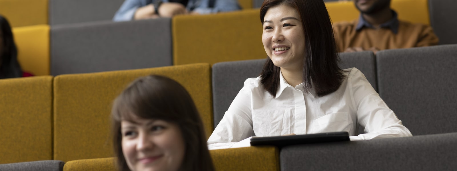 Students in a lecture hall.