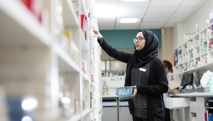 A pharmacy student working on-campus