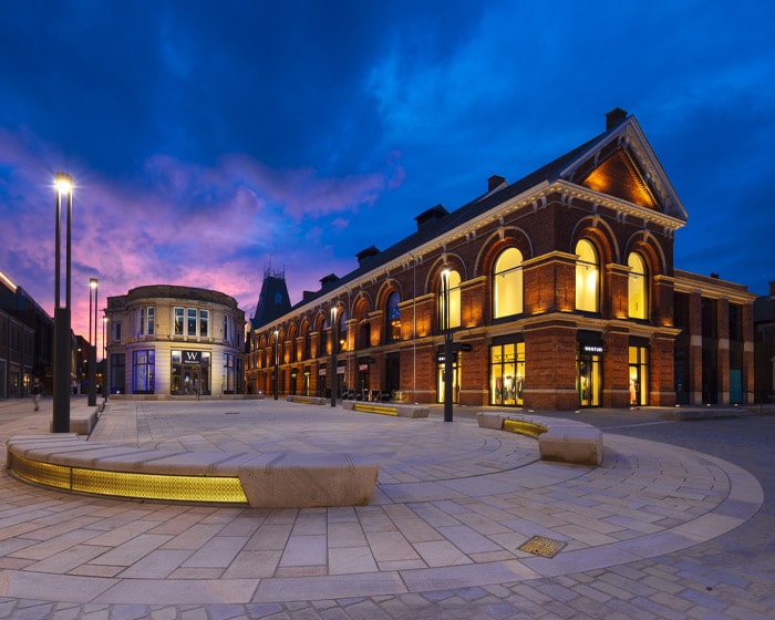 The Lincoln Cornhill Quarter with lights on at night time