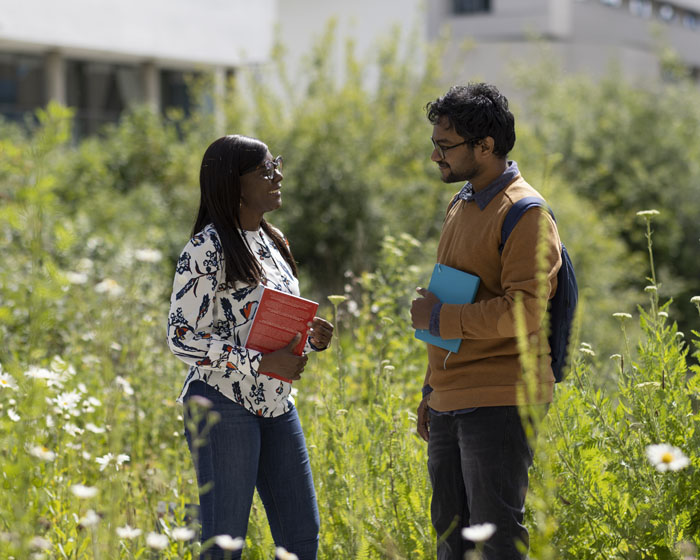 Two students chatting on campus