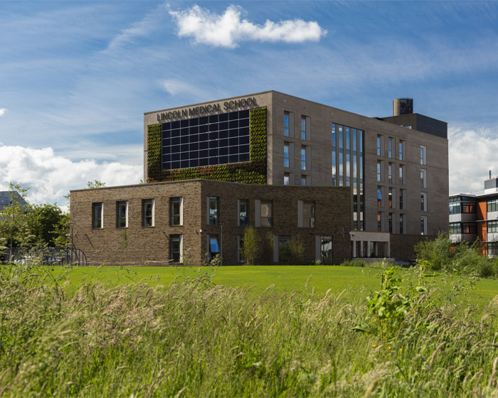 Outside of the Lincoln medical School with grass in the foreground