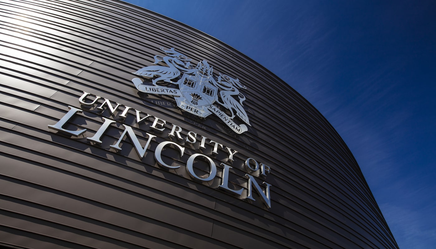 The University of Lincoln logo on the exterior of a building