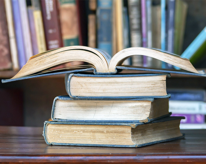 Old books stacked on a table