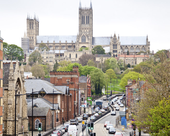 Streets with traffic with Lincoln Cathedral in the background
