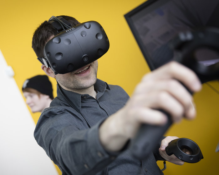 A student testing virtual reality equipment