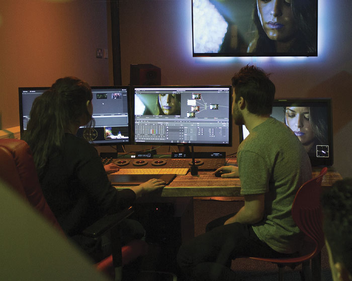 Students working in a film and television studio