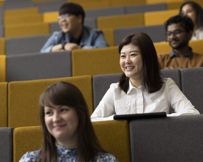 A class of students sitting in a lecture theatre