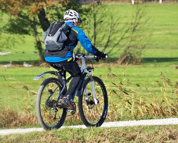 A person riding a bike through the countryside