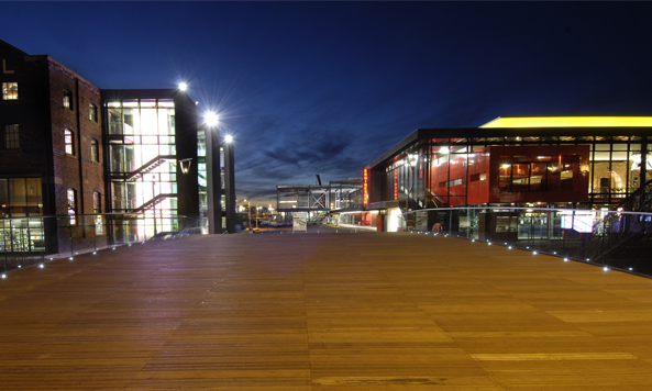 The main walkway of the University of Lincoln campus at night time