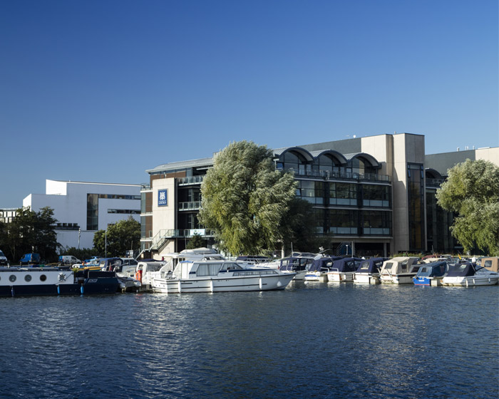 The outside of the University of Lincoln Minerva building at the side of the water