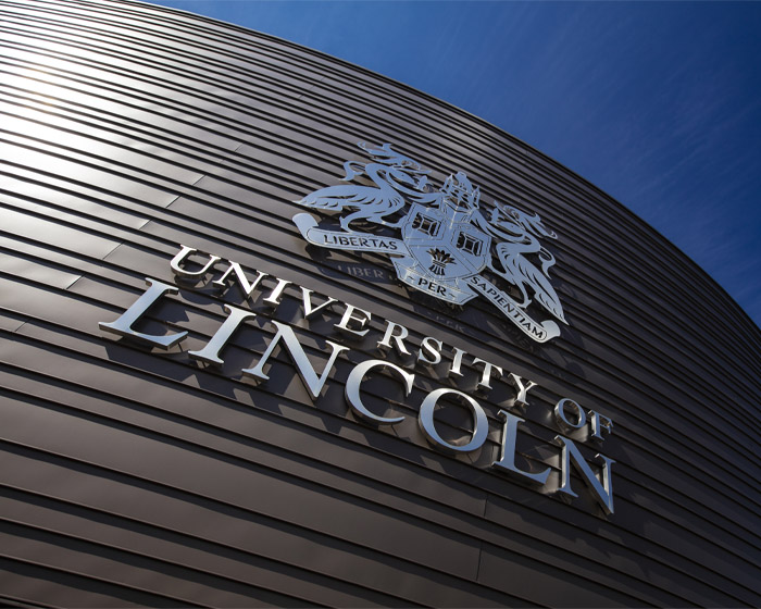 The University of Lincoln logo on the side of a building