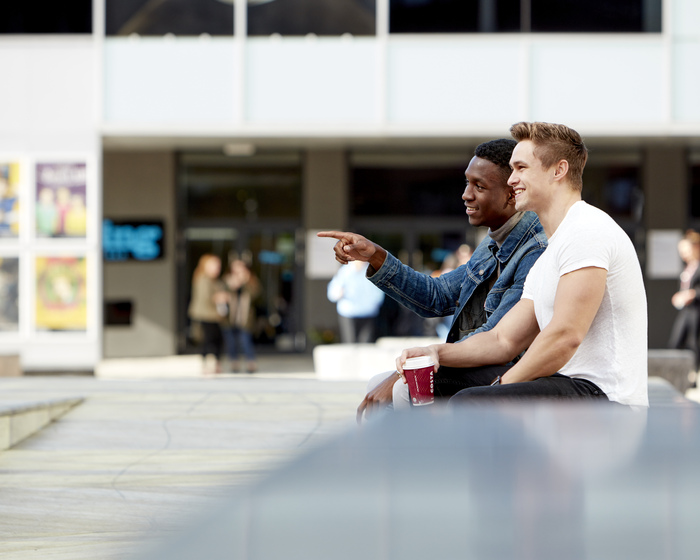 Students chatting outside Lincoln Arts Centre