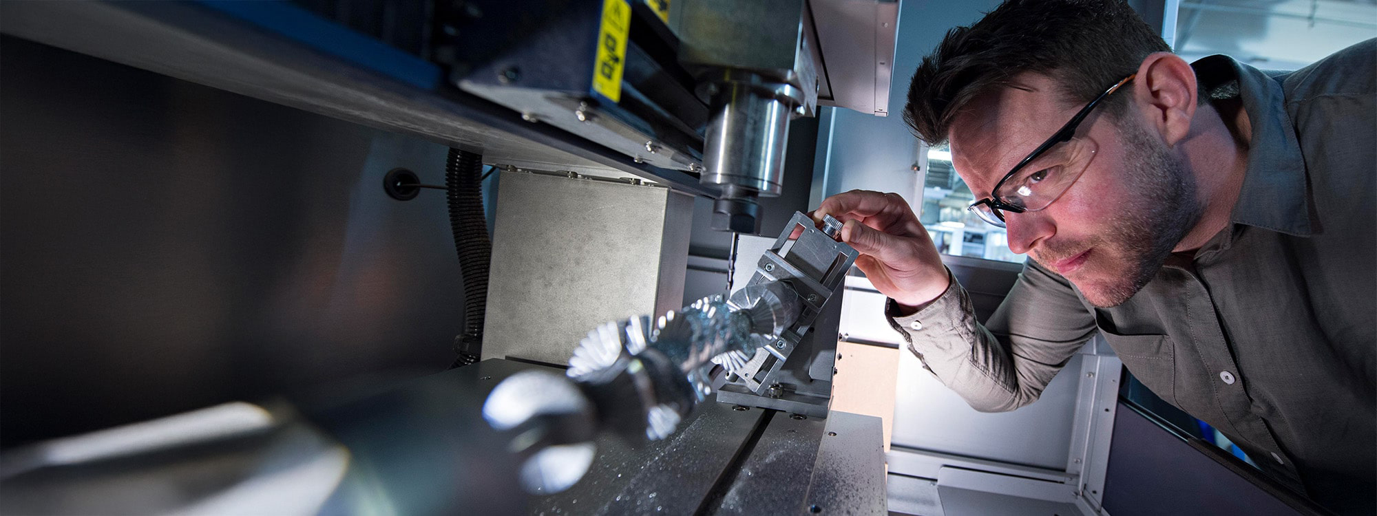 A researcher using specialised equipment in a lab
