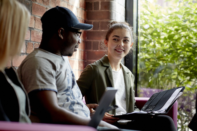 Students chatting in the University Library