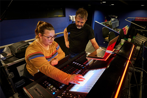 Student and lecturer working on a light console
