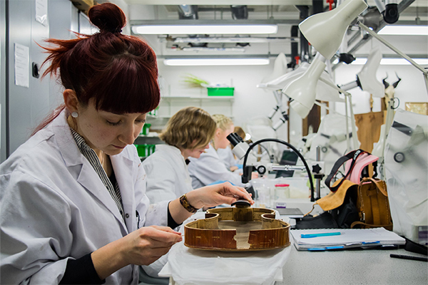 A student working on conserving an item