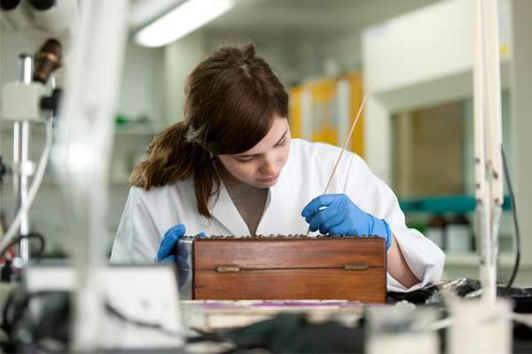 A student working on a box