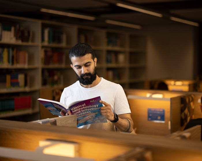 A student reading a medical text