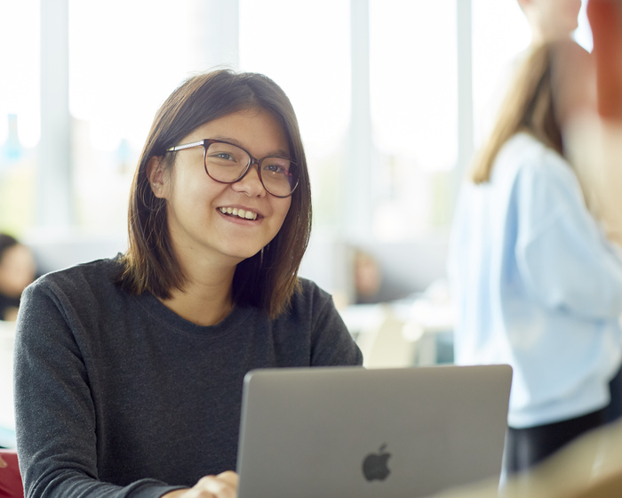 A student using a laptop