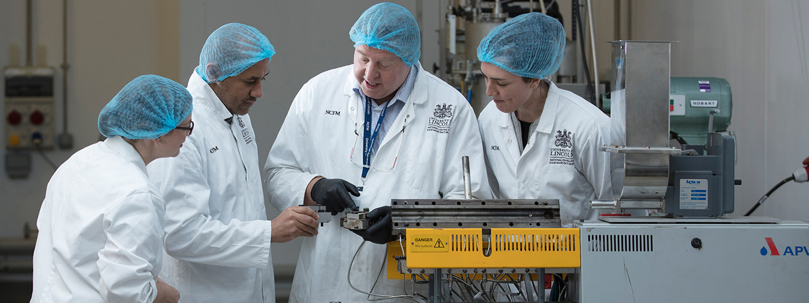 NCFM apprentices working in the factory