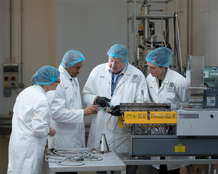 NCFM apprentices working in the factory