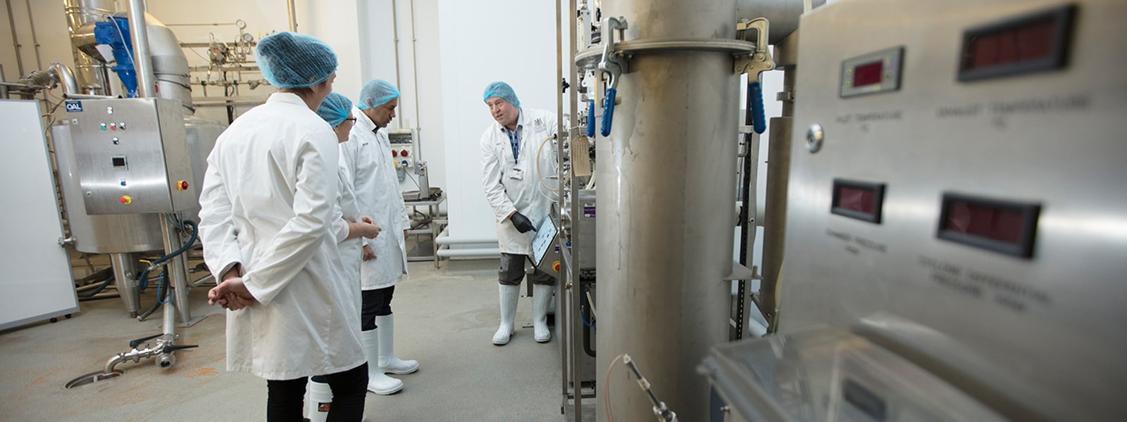 People being shown around food manufacturing facilities at NCFM
