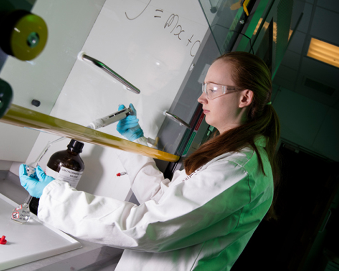A student carrying out practical work in the lab