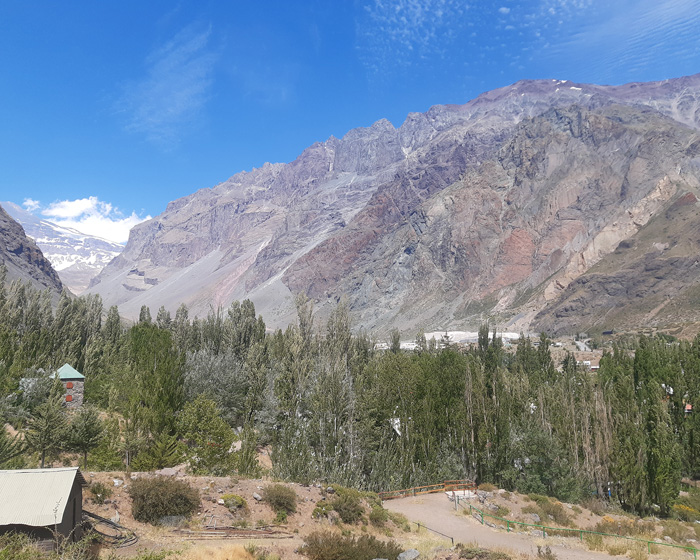 A mountain with trees in the foreground