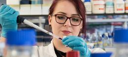 Female scientist in pharmaceutical laboratory.