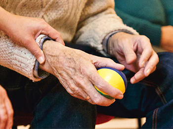 Elderly gentleman with healthcare worker. 