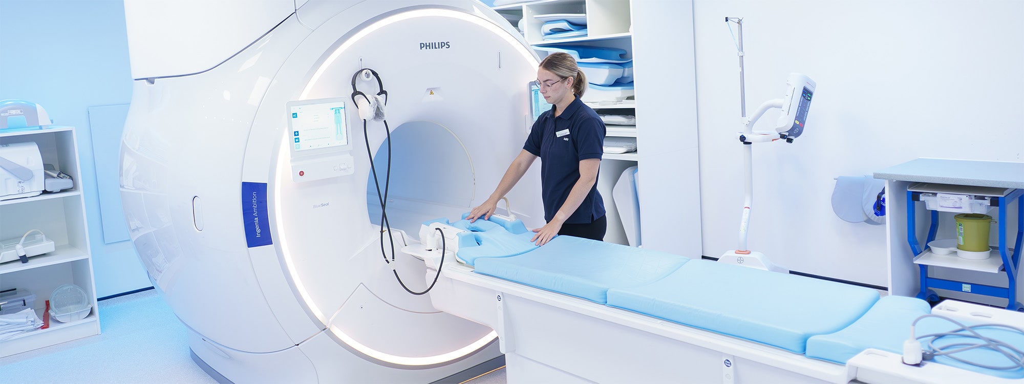 A Radiographer preparing an MRI Scanner