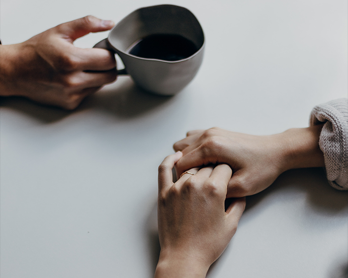 Relaxed hands on table