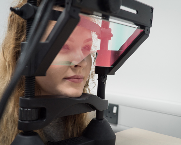 A Psychology student using eye-tracking equipment