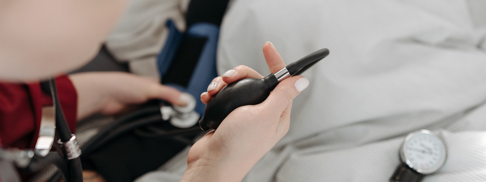 Health care professional attending to a patient.