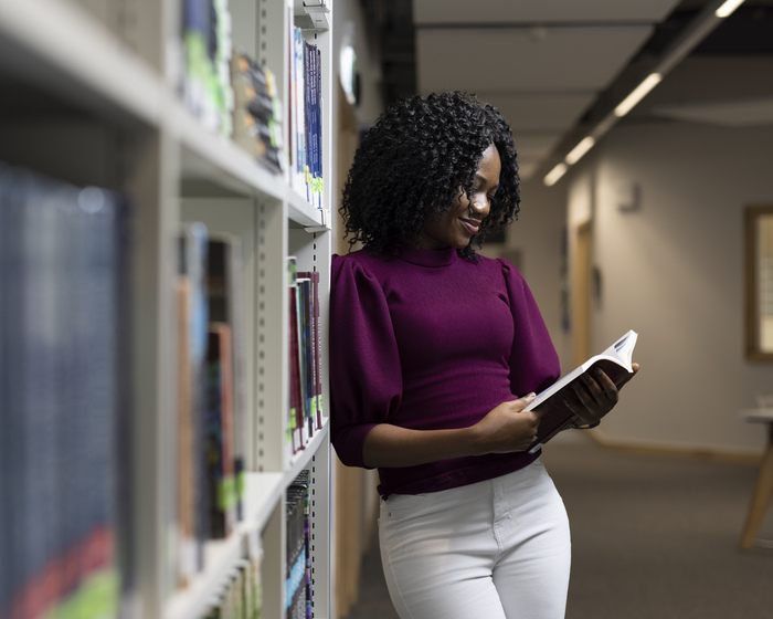 A student reading in the library