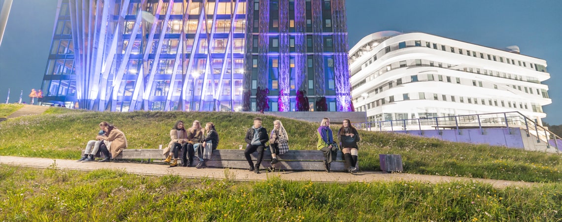 A group of students outside of a university building in Riga, Latvia