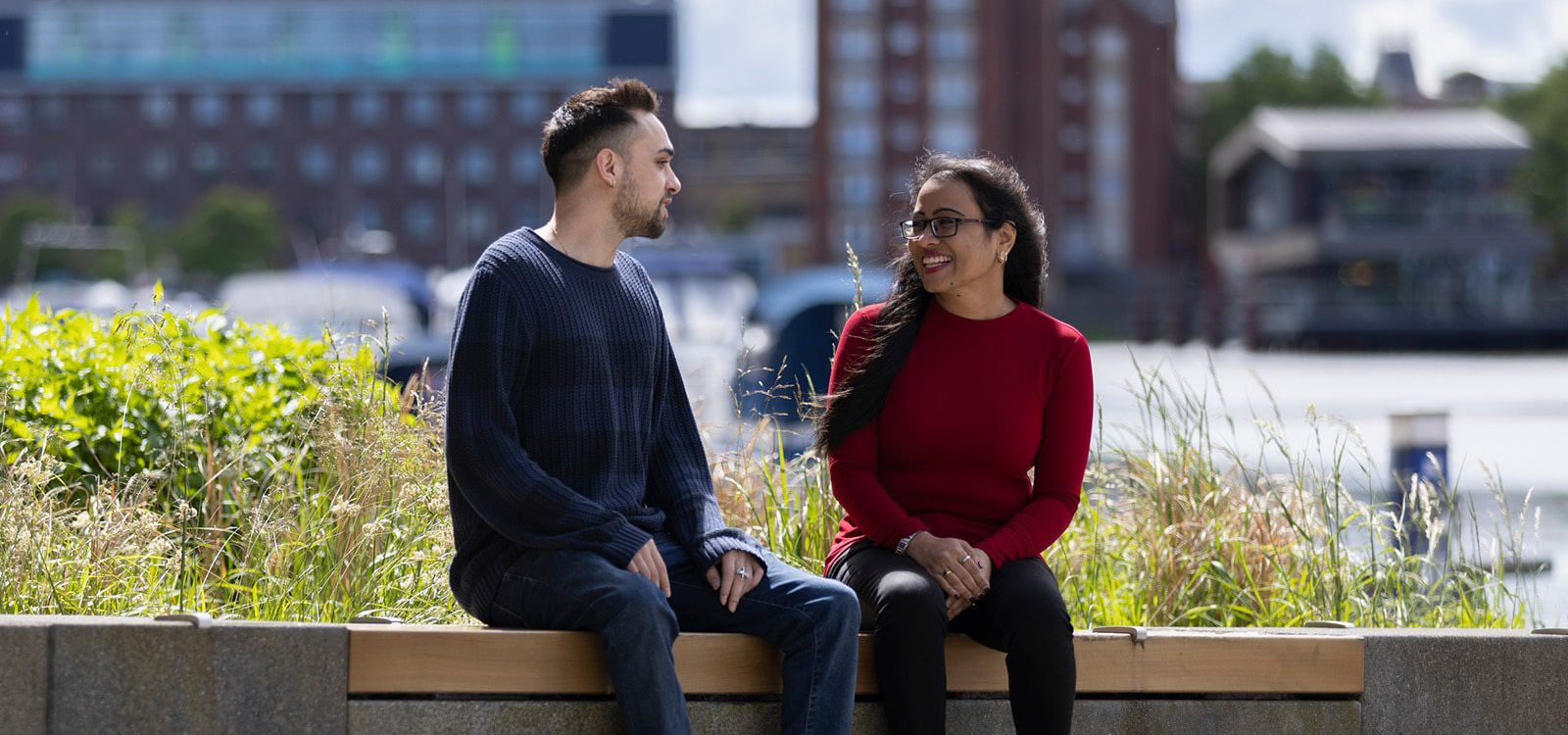 Two students chatting by the waterfront