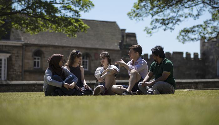 Students sitting in the sun at Lincoln Cathedral