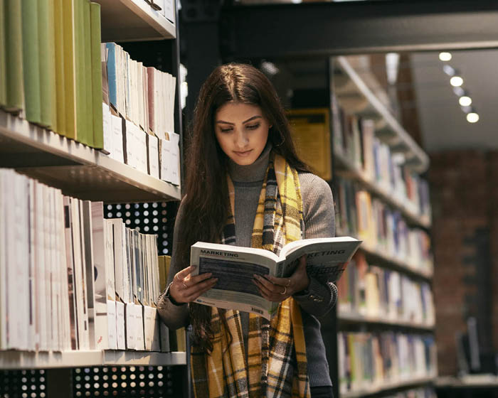 Student reading in the library